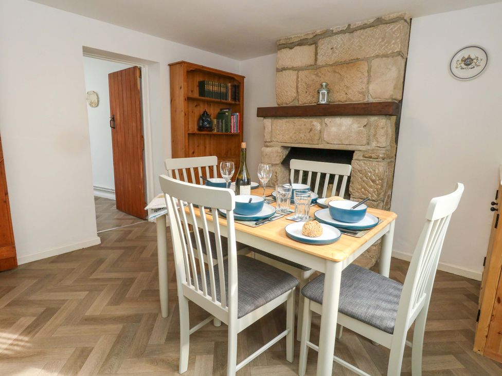 A dining room with a table set for a meal at NO 10 Fortuneswell