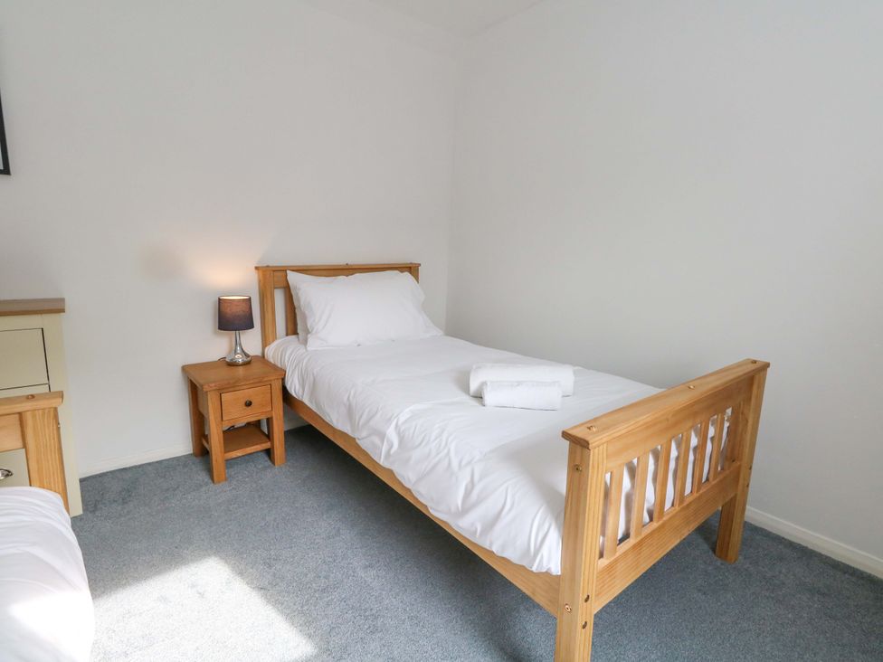 A bedroom with a single bed and nightstand at NO 10 Fortuneswell
