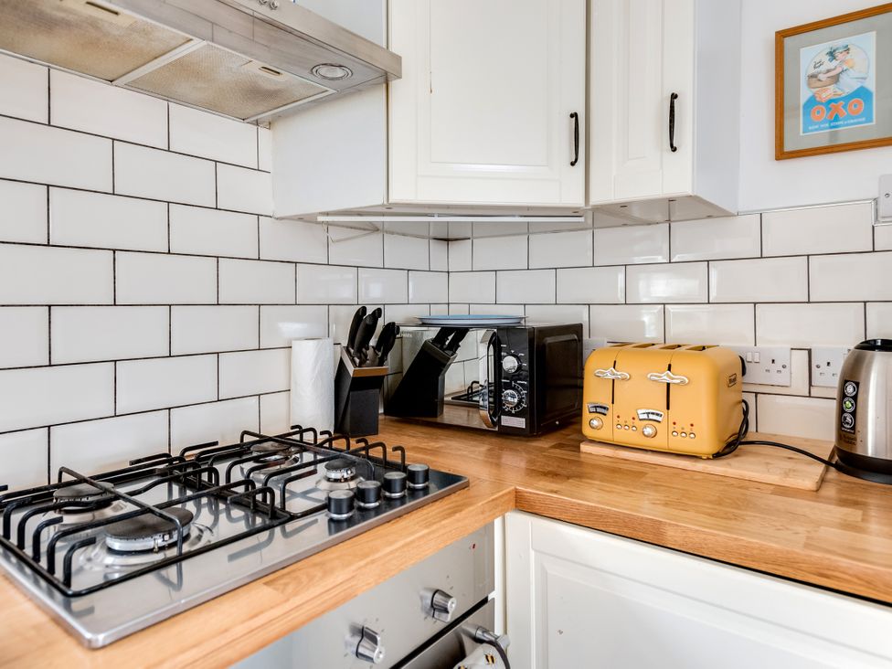 A kitchen with a gas stove and appliances at Florence of Oxford in Oxford