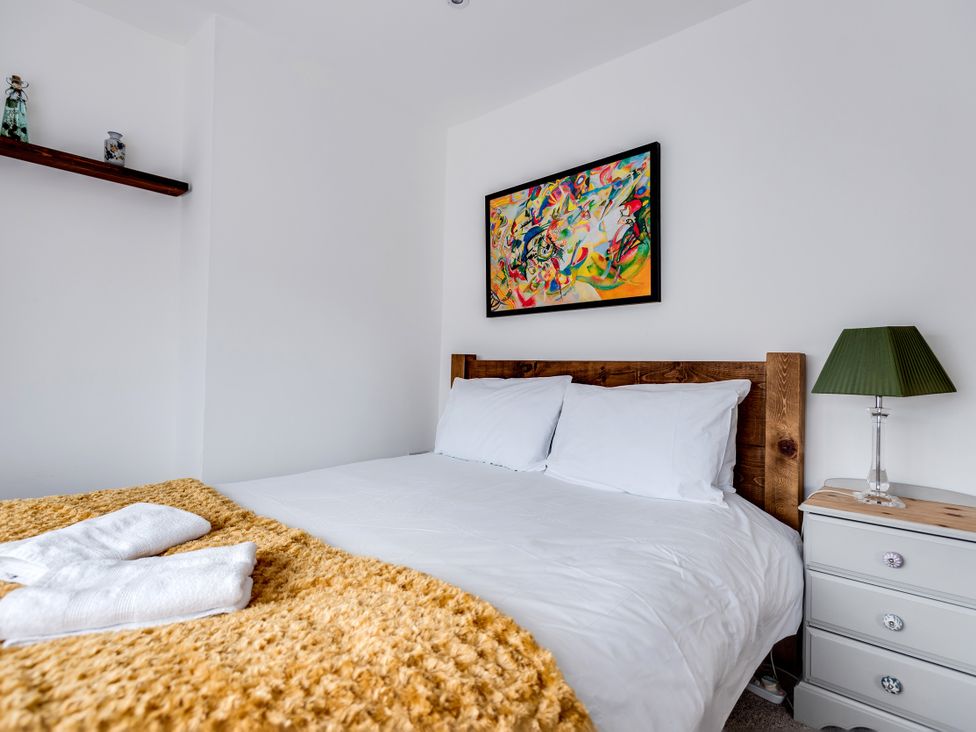 A bedroom with a bed and nightstand at Florence of Oxford in Oxford