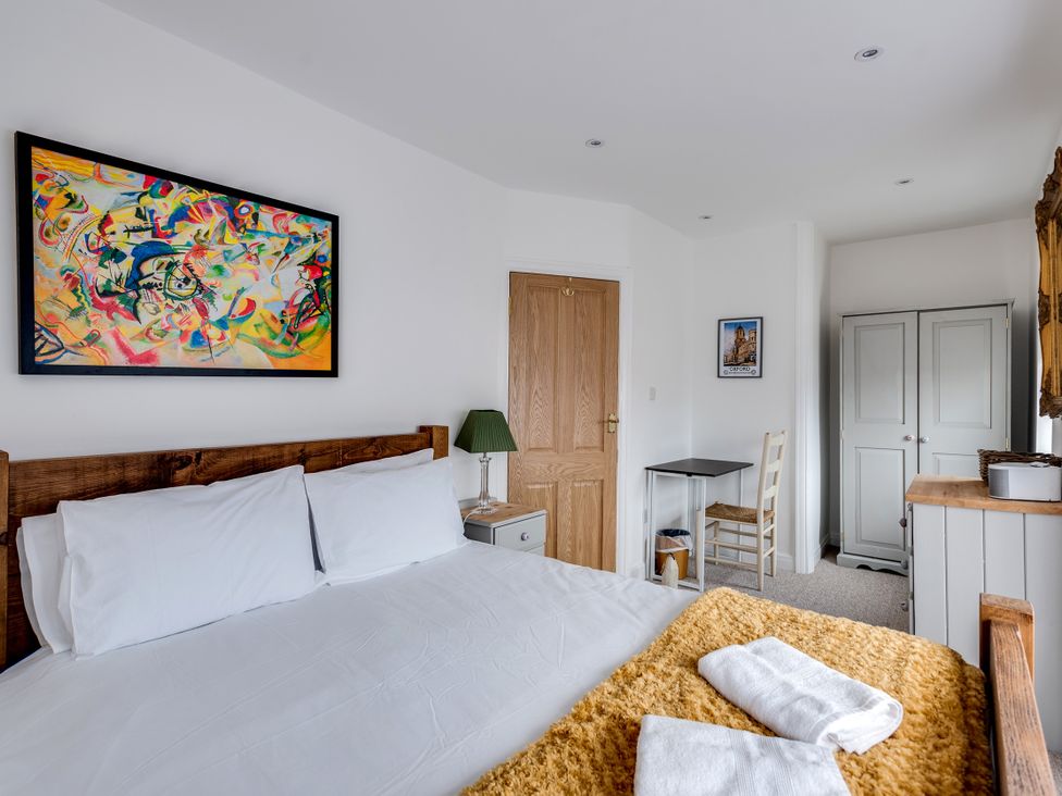 A bedroom with a bed and a table at Florence of Oxford in Oxford