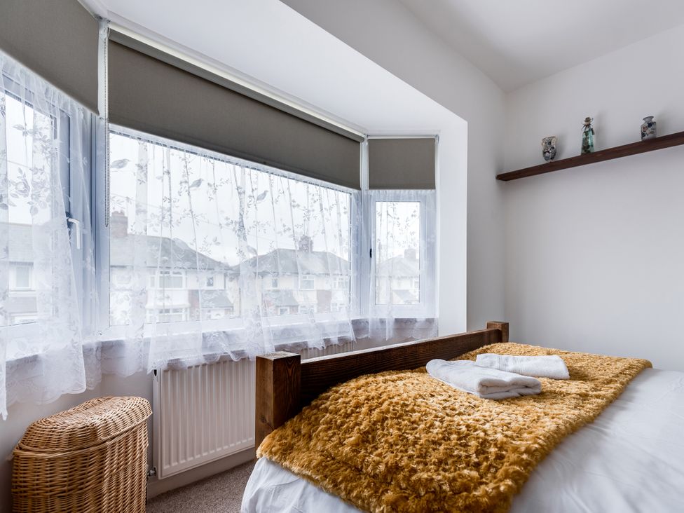A bedroom with a bed and towels at Florence of Oxford in Oxford