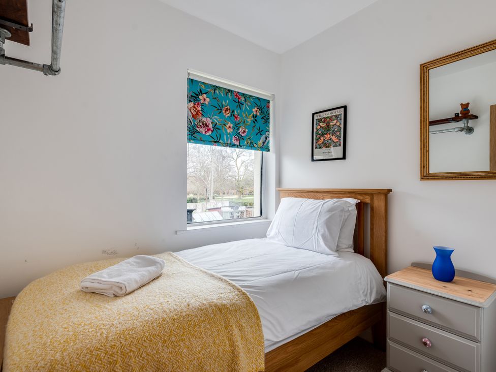 A bedroom with a bed and window at Florence of Oxford, Oxford