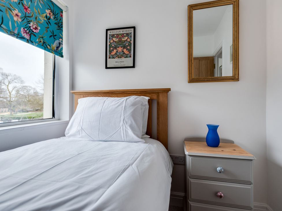 A bedroom with a bed and nightstand at Florence of Oxford, Oxford