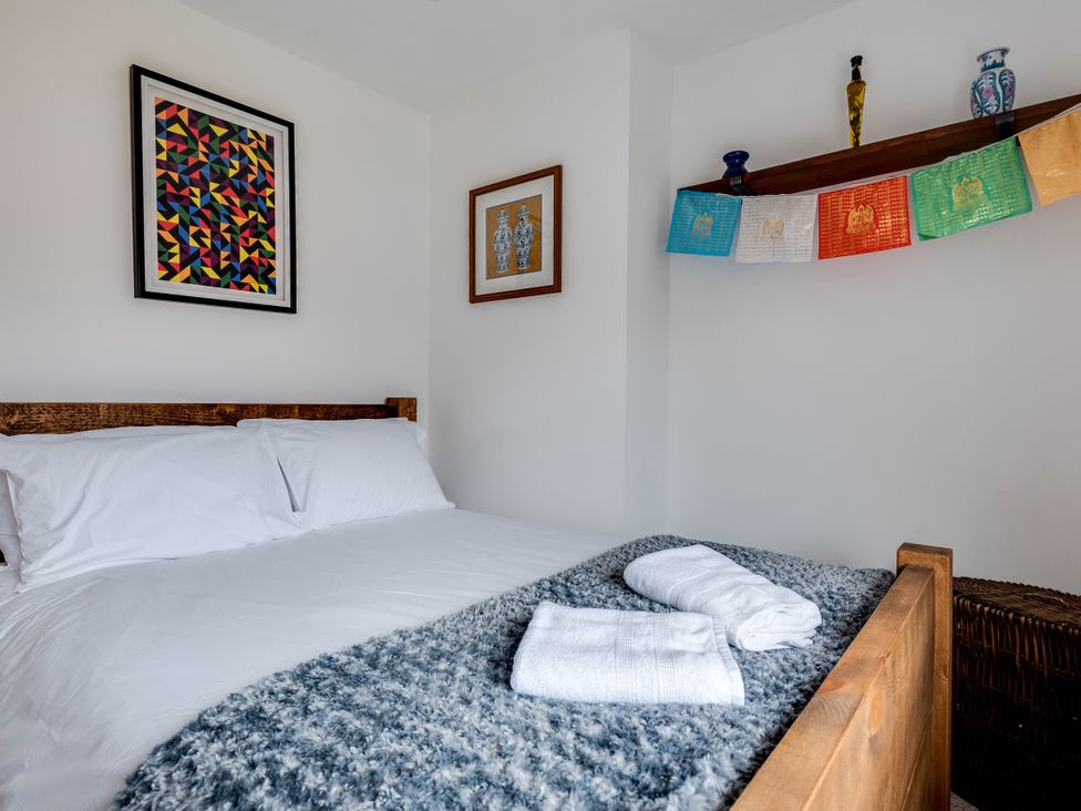 A bedroom with a bed and wall art at Florence of Oxford in Oxford