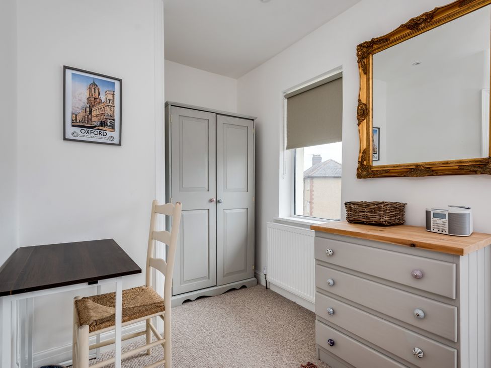 A bedroom with a table and chair at Florence of Oxford in Oxford
