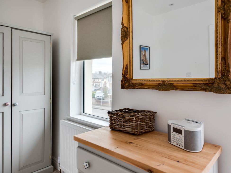 A bedroom with a wardrobe and a mirror at Florence of Oxford in Oxford