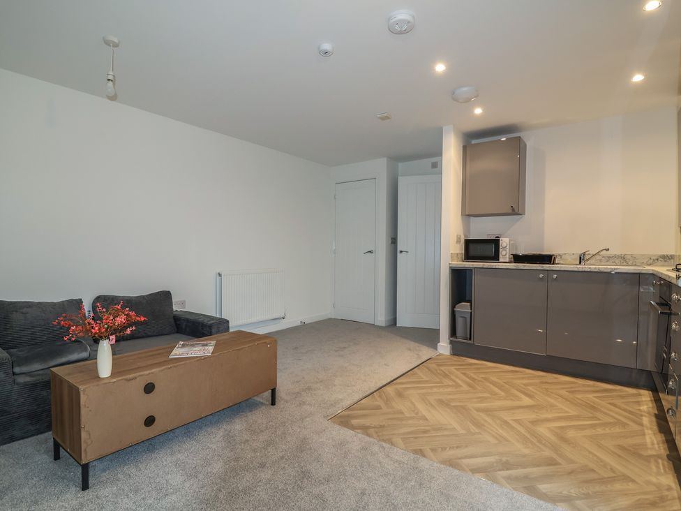 A living room with a sofa and coffee table at Apartment 7 at Anfield Liverpool