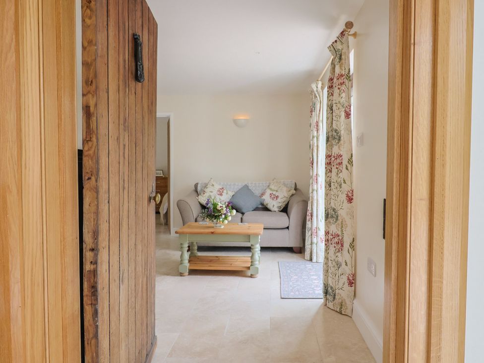 A living room with a sofa and coffee table at Harbins Farm Glanvilles Wootton Nr. Sherborne