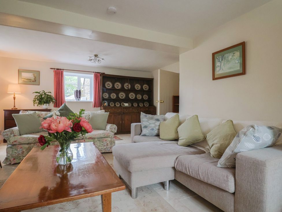 A living room with sofa and lamp at Harbins Farm Glanvilles Wootton Nr. Sherborne