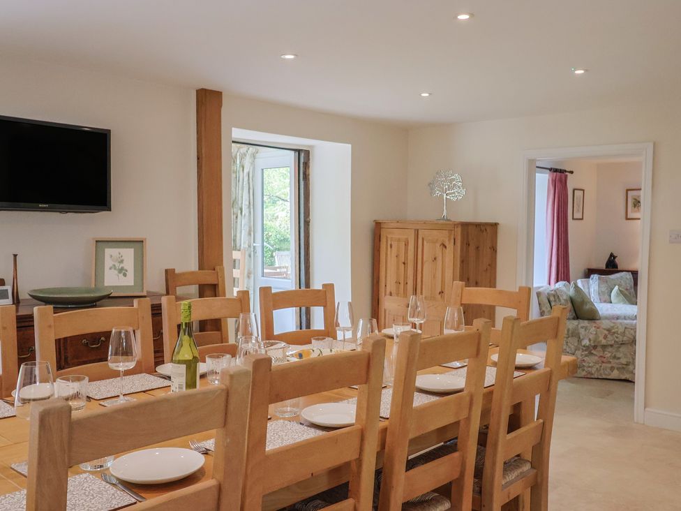 A dining room with a large table and chairs at Harbins Farm in Glanvilles Wootton Nr. Sherborne