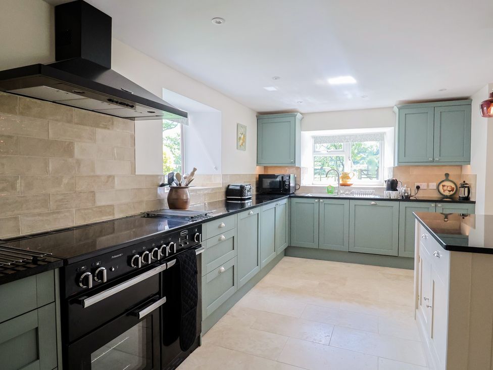 A kitchen with cabinets and appliances at Harbins Farm Glanvilles Wootton Nr. Sherborne