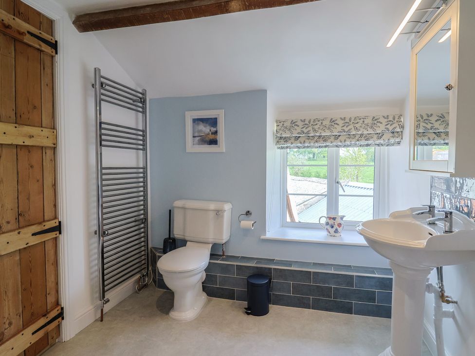 A bathroom with a toilet and sink at Harbins Farm Glanvilles Wootton Nr. Sherborne