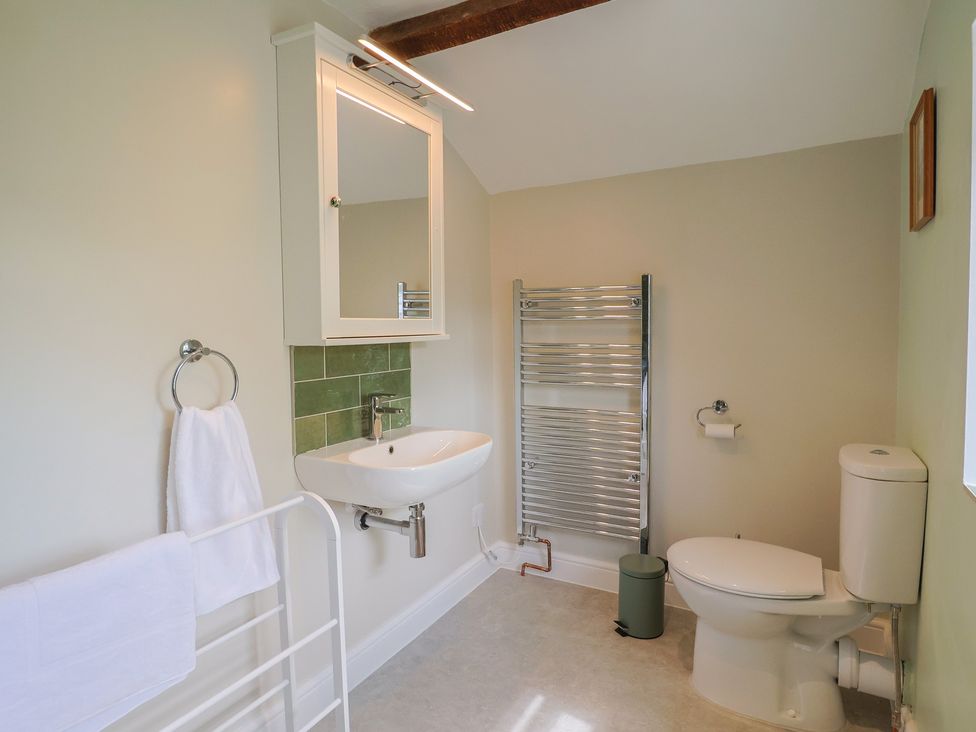 A bathroom with a wash basin and toilet at Harbins Farm Glanvilles Wootton Nr. Sherborne
