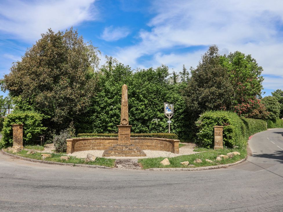A roundabout with an obelisk and greenery at Harbins Farm in Glanvilles Wootton Nr. Sherborne