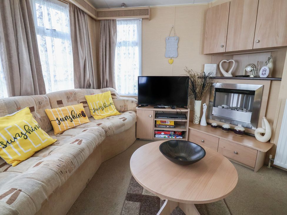 A living room with a sofa and television at Winchester - 244