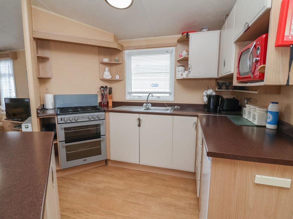 A kitchen with appliances and countertop at Winchester - 244