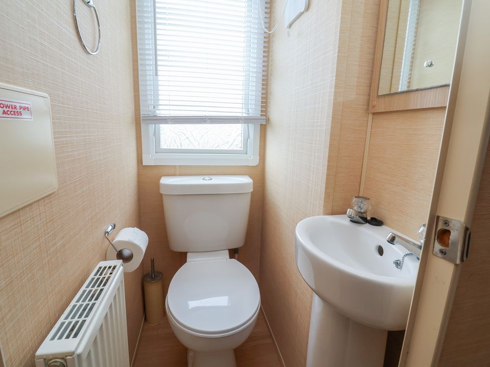 A bathroom with a toilet and sink at Winchester - 244