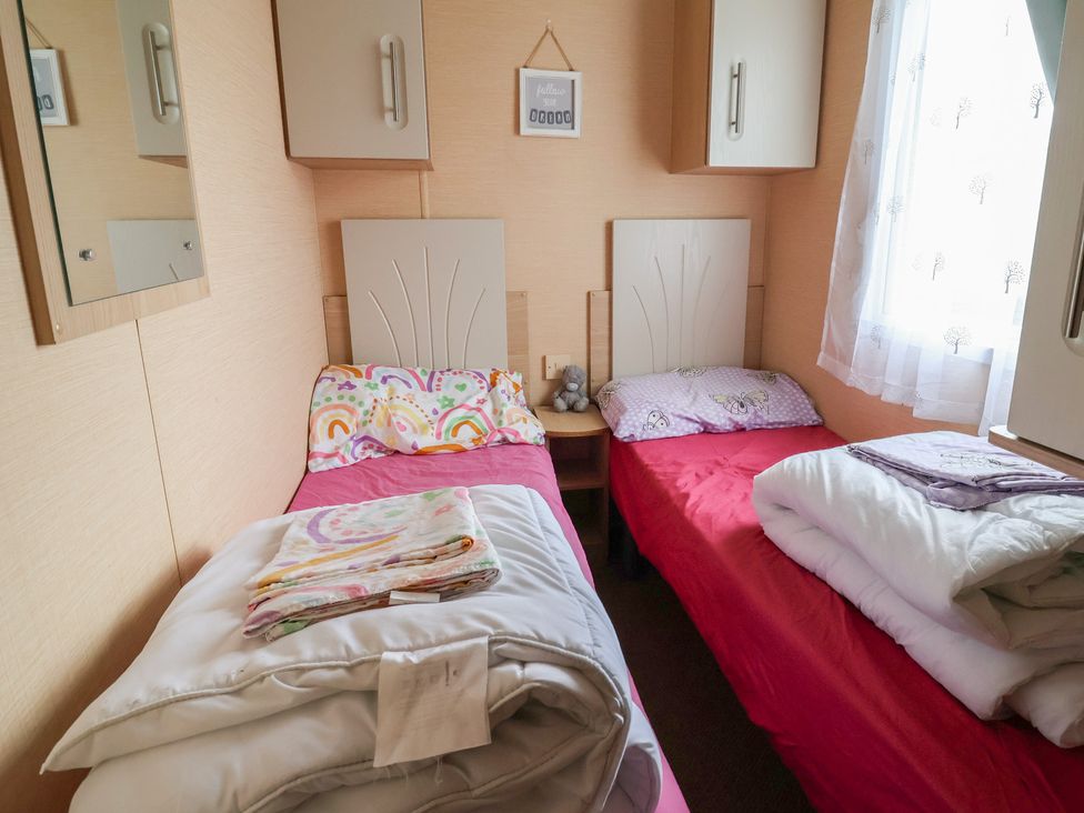 A bedroom with two beds and storage at Winchester - 244