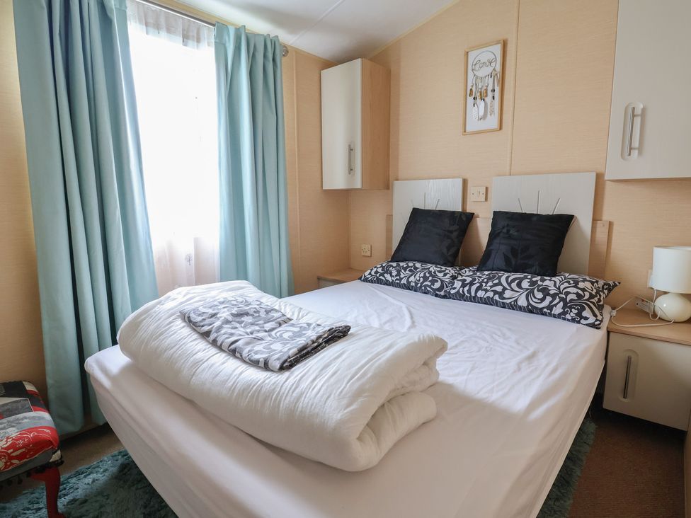 A bedroom with a bed and nightstand at Winchester - 244