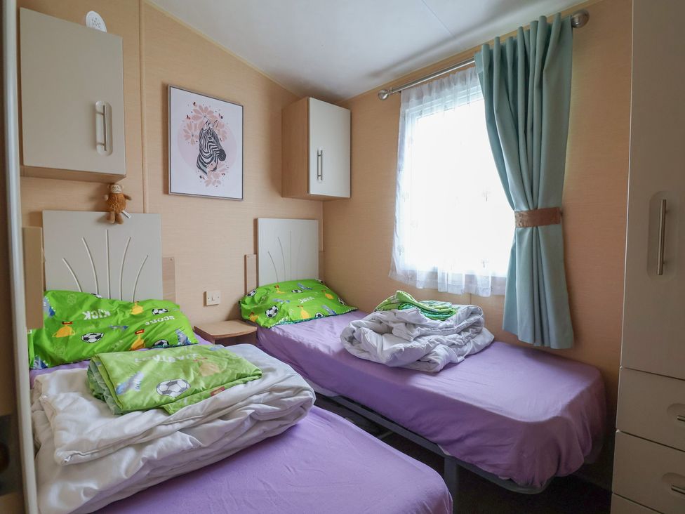 A bedroom with two beds and cabinets at Winchester - 244