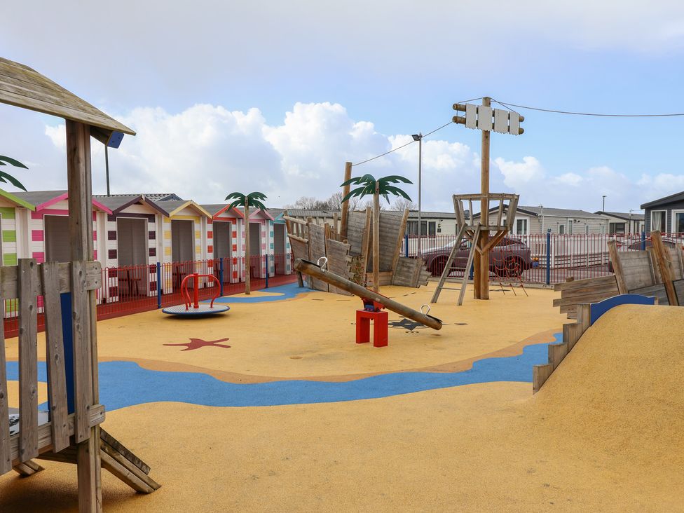 A playground with play equipment and structures at Winchester - 244