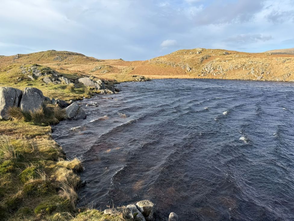 A body of water surrounded by rocky terrain at Pandora in Holmrook