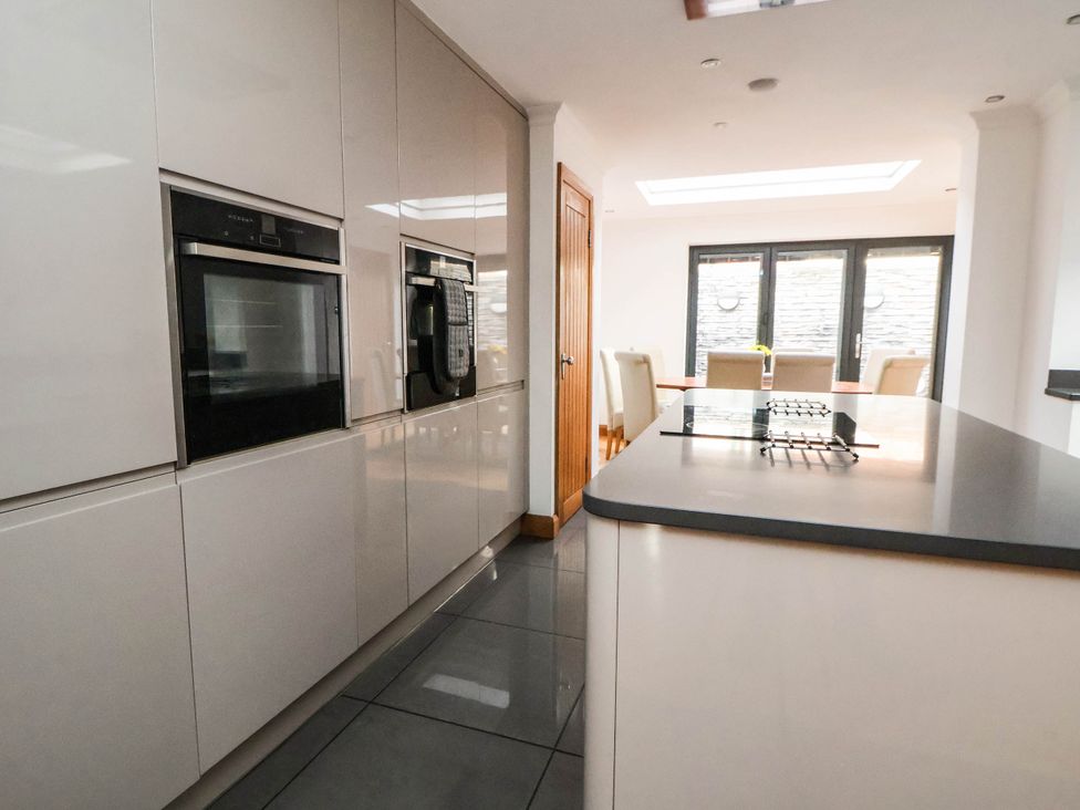 A kitchen with cabinets and ovens at Seaside Home in New Brighton