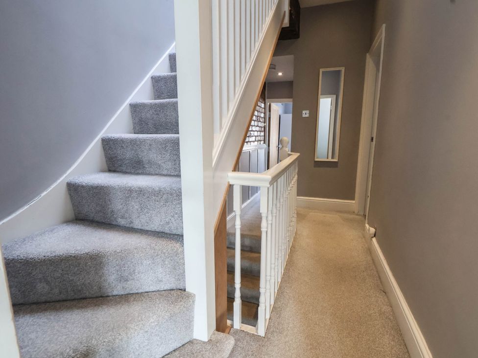A staircase and hallway at Seaside Home in New Brighton