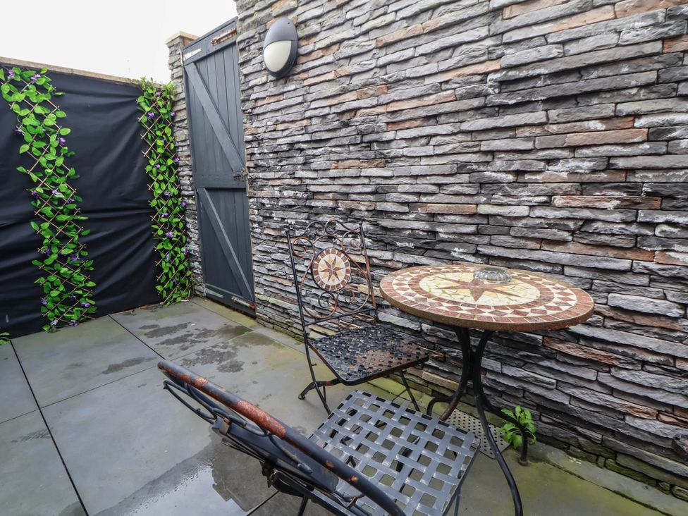 An outdoor space with a table and chairs at Seaside Home in New Brighton
