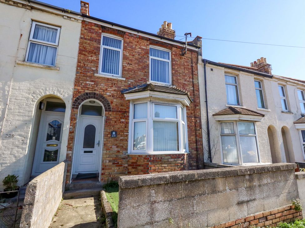 A red brick house with a front garden at Home from Home near the Sea Weymouth