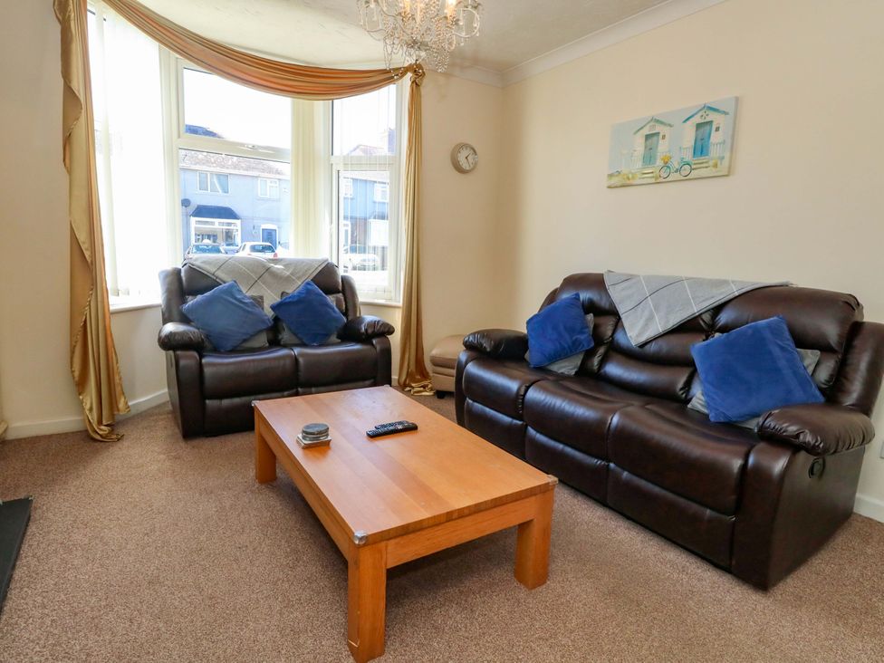 A living room with two sofas and a coffee table at Home from Home near the Sea in Weymouth