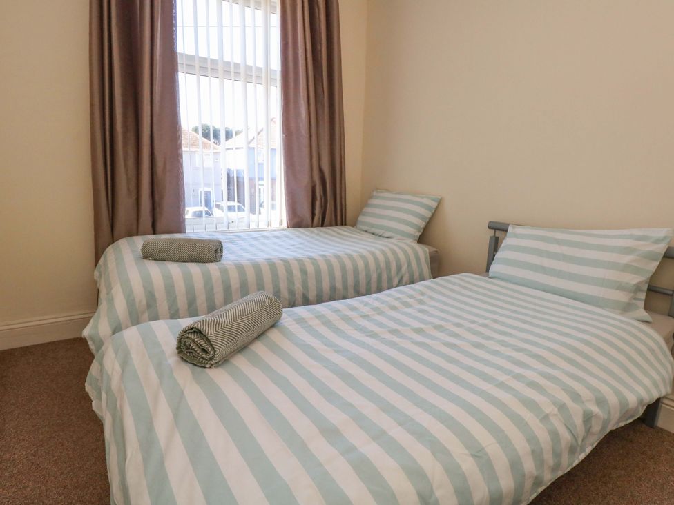A bedroom with two single beds at Home from Home near the Sea in Weymouth