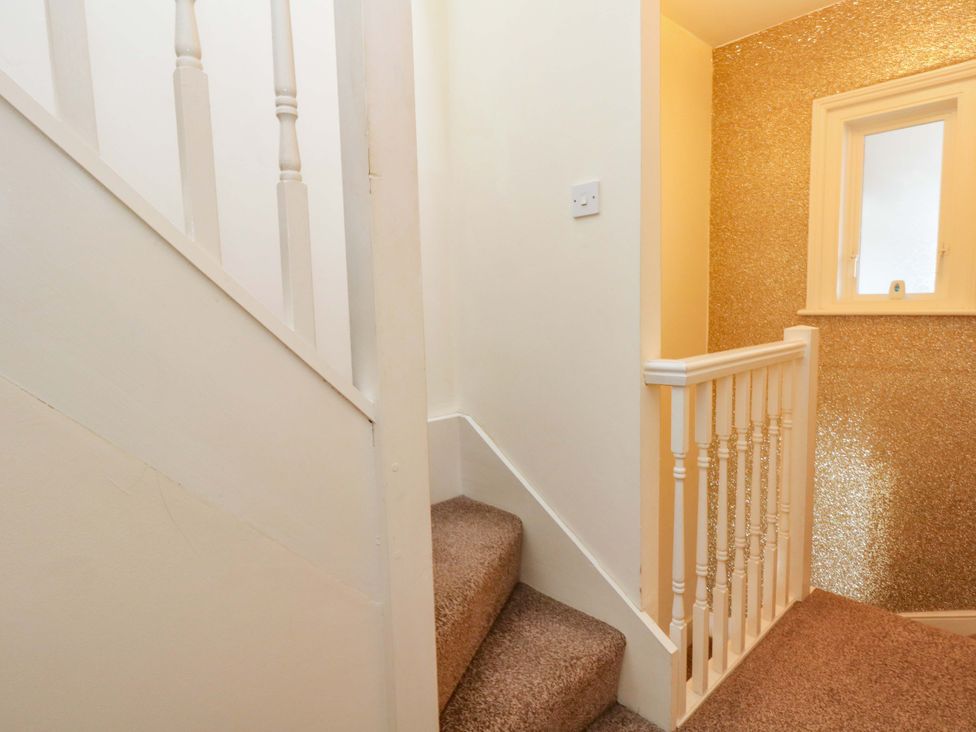 A staircase leading to a landing at Home from Home near the Sea Weymouth
