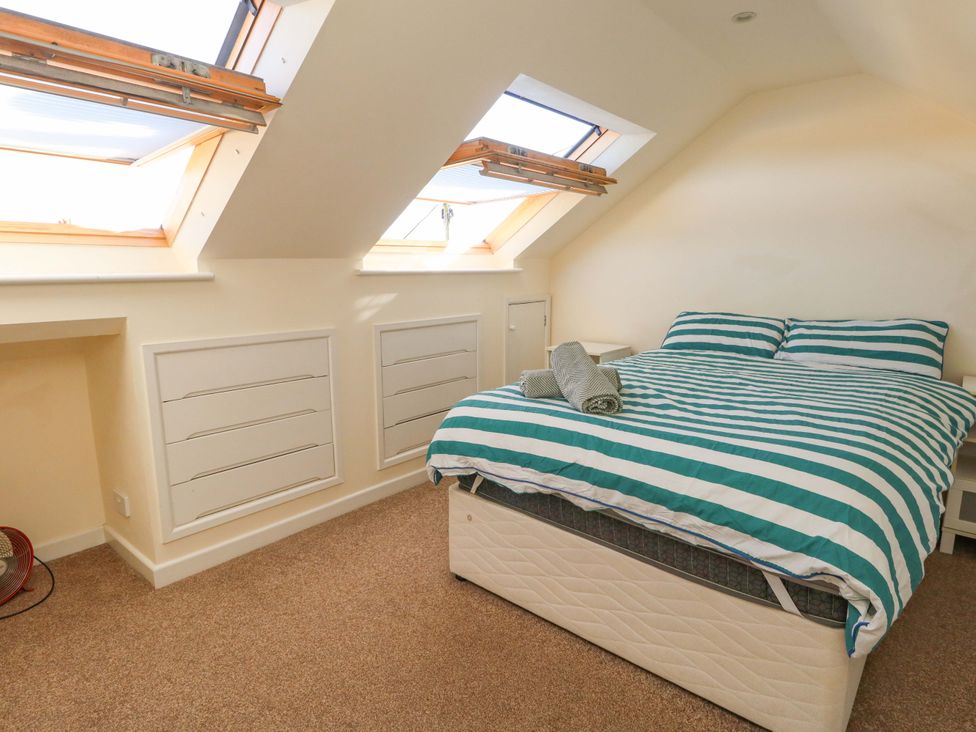 A bedroom with a bed and skylights at Home from Home near the Sea in Weymouth