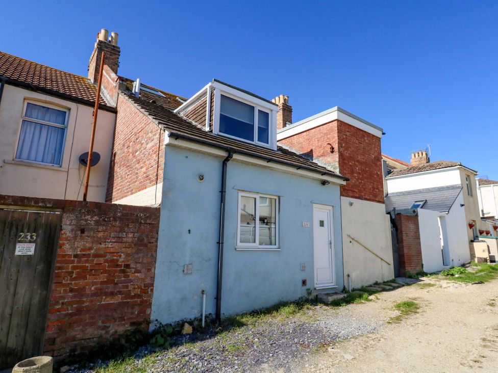 A house with windows and a door at Home from Home near the Sea Weymouth