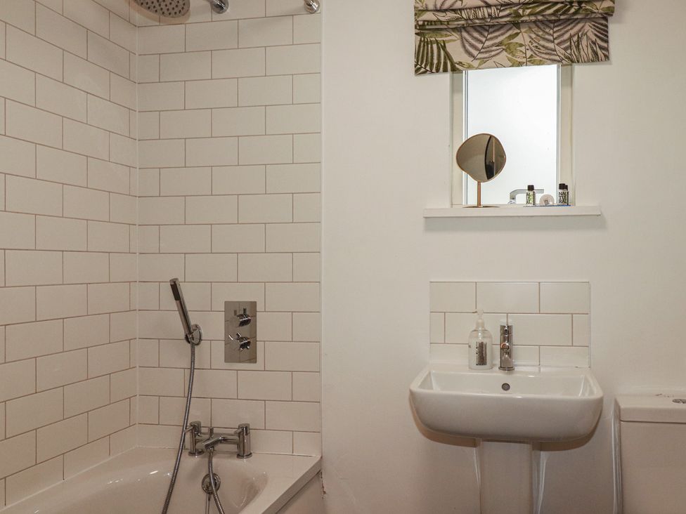 A bathroom with shower and sink at Little Hallegan in Camborne