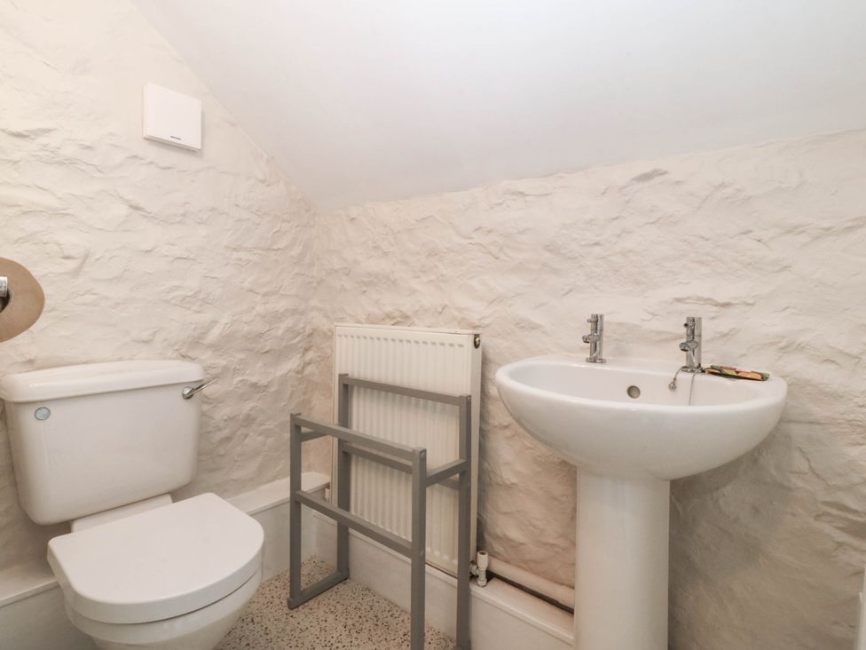 A bathroom with a toilet and sink at Little Oak near Tal-Y-Bont
