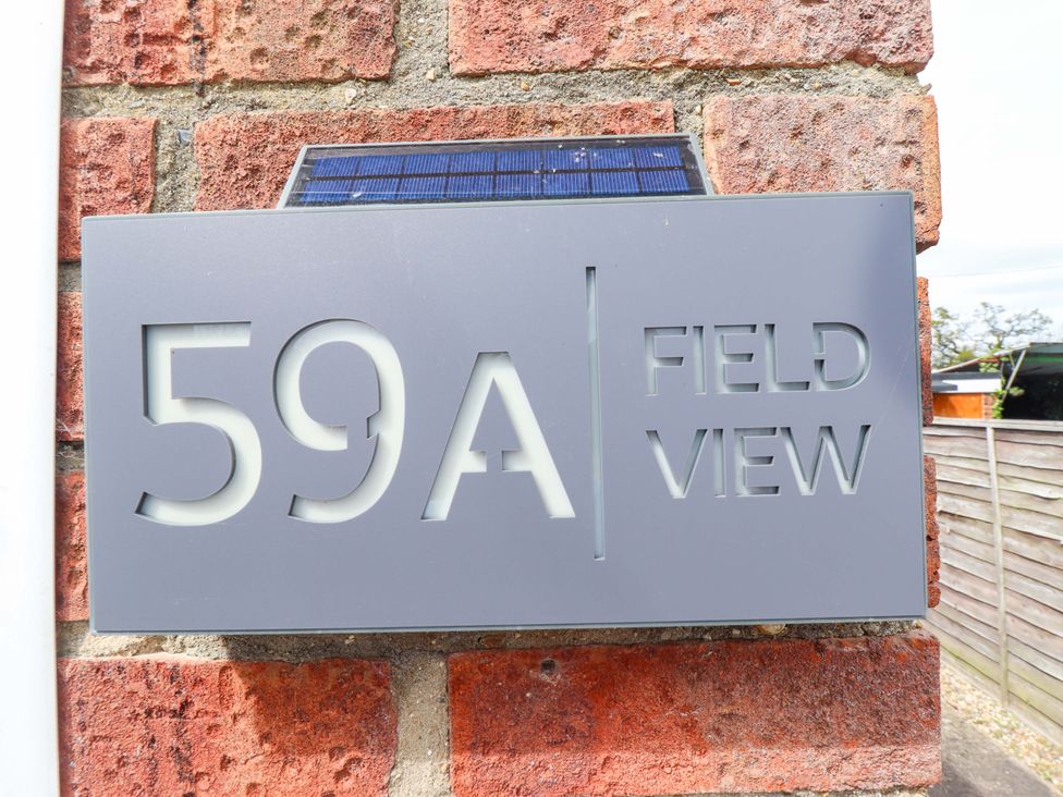 A property nameplate displaying 59A Field View