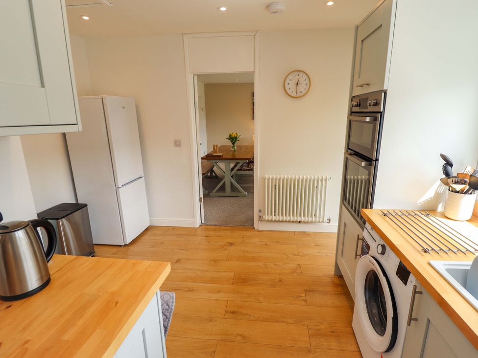 A kitchen with appliances and countertop at Field View in North Walsham