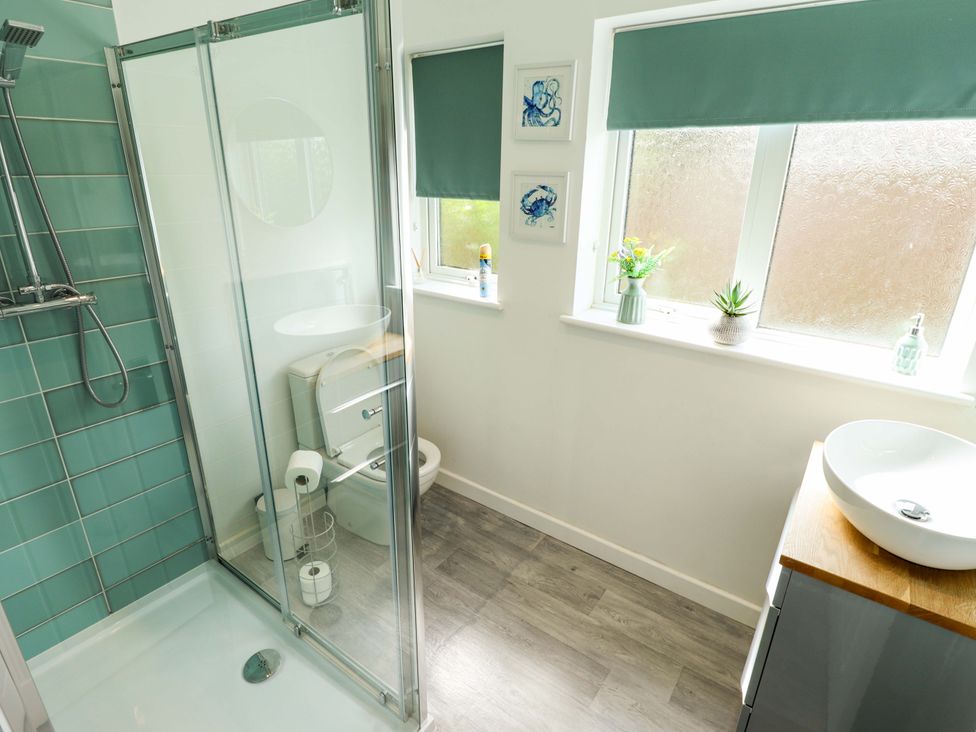 A bathroom with a shower and toilet at Field View in North Walsham