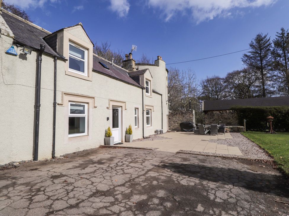 An outdoor area with a patio and seating arrangement at Craig Cottage in Banff