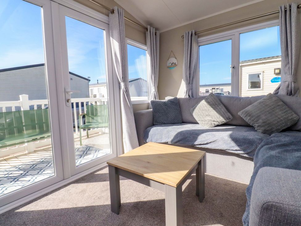A living room with a sofa and coffee table at Plot B2 Crozzers Place in Morecambe
