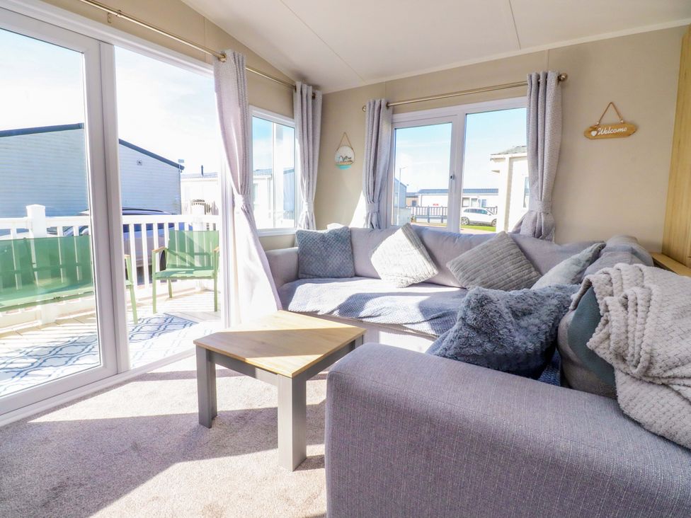 A living room with a sofa and coffee table at Plot B2 Crozzers Place in Morecambe