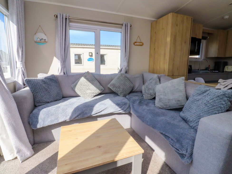 A living room with a sofa and coffee table at Plot B2 Crozzers Place in Morecambe
