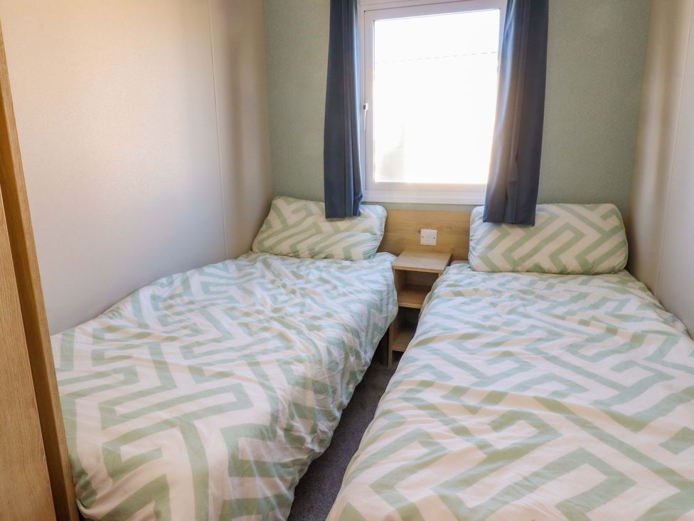 A bedroom with two beds and a window at Plot B2 Crozzers Place Morecambe