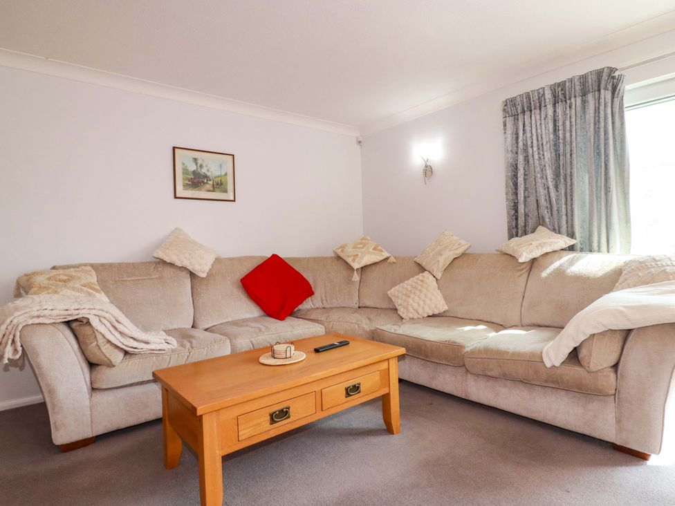 A living room with a sofa and coffee table at Tregoning in Lostwithiel