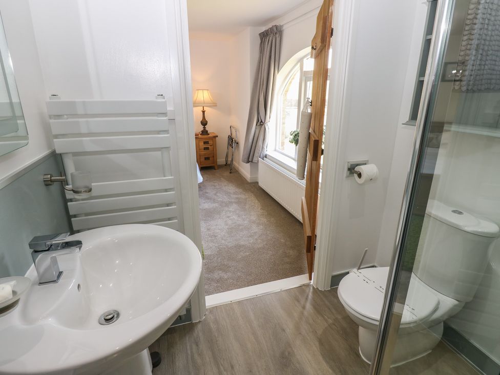 A bathroom with a sink and shower at Castle View Cottage Bedale