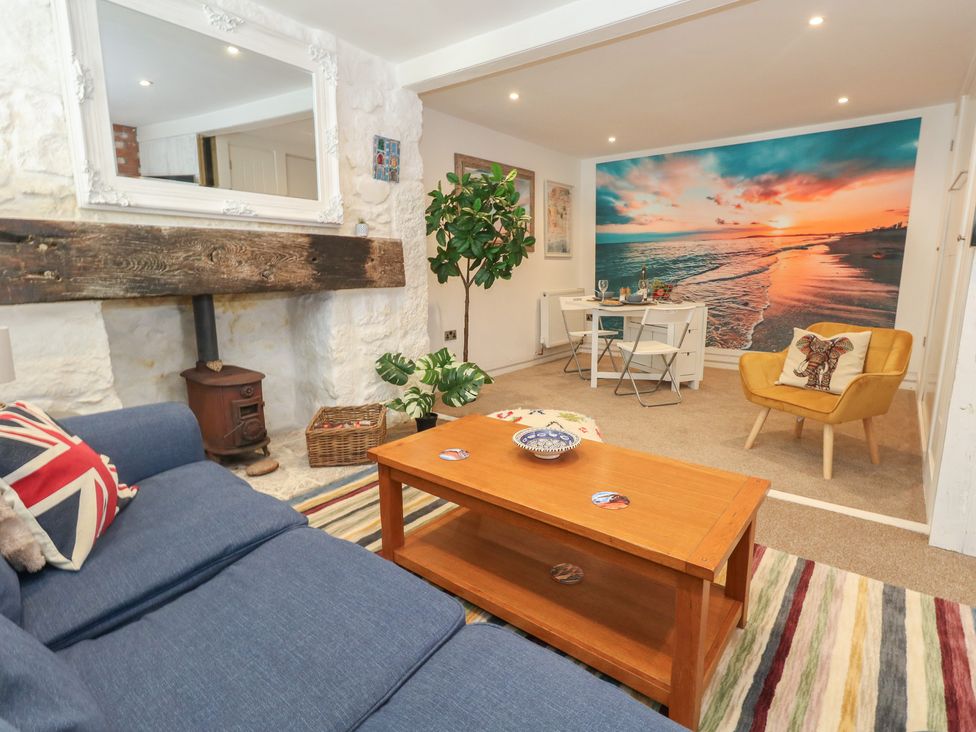 A living room with a sofa and a coffee table at Tipsy Turtle in Weymouth