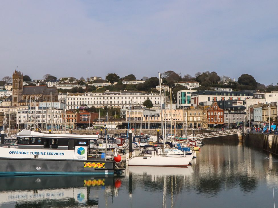 A harbor with boats and buildings at Marina Court Apartment in Torquay